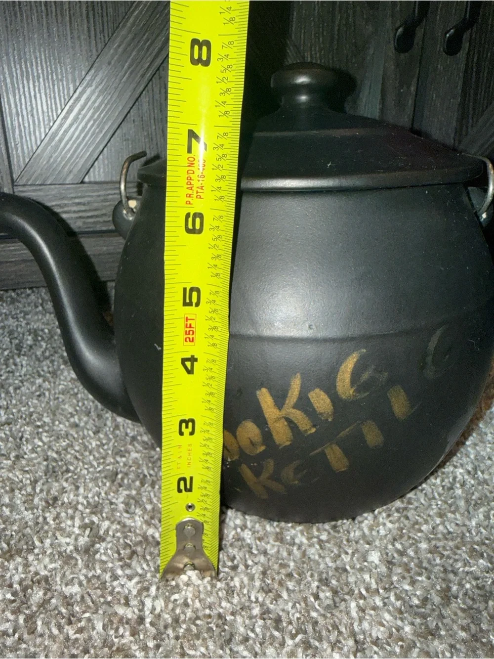 McCoy Pottery Kookie Kettle cookie jar crafted from black ceramic